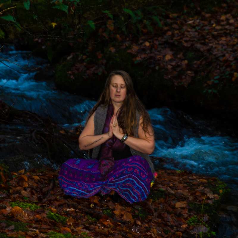 Beth meditating in nature