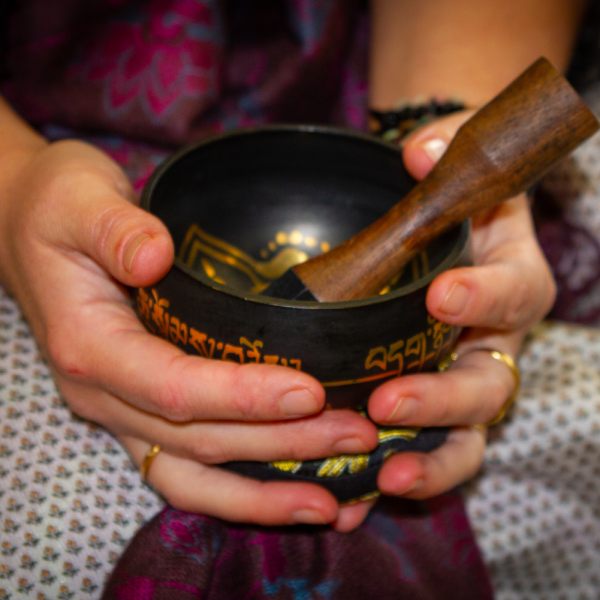 hands-holding-sound-healing-bowl